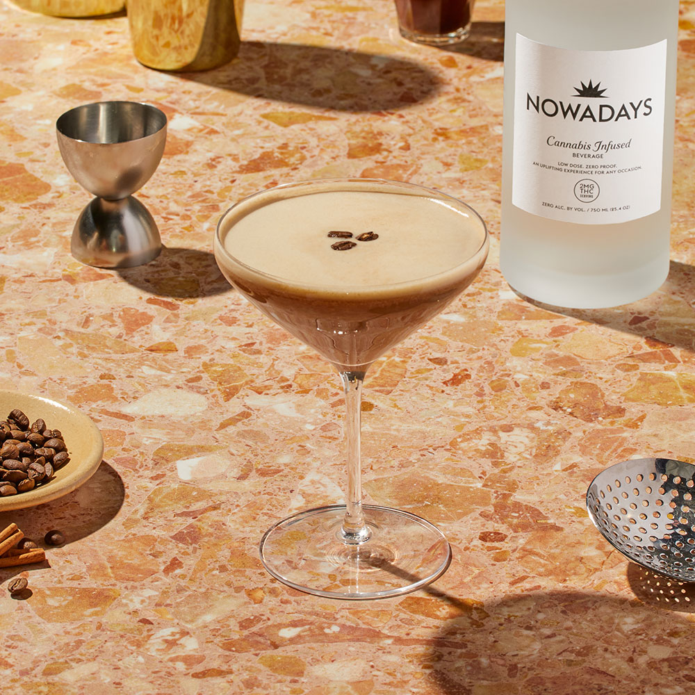 Nowadays Wake Whenever Cannabis Infused Cocktail with coffee beans on textured counter top